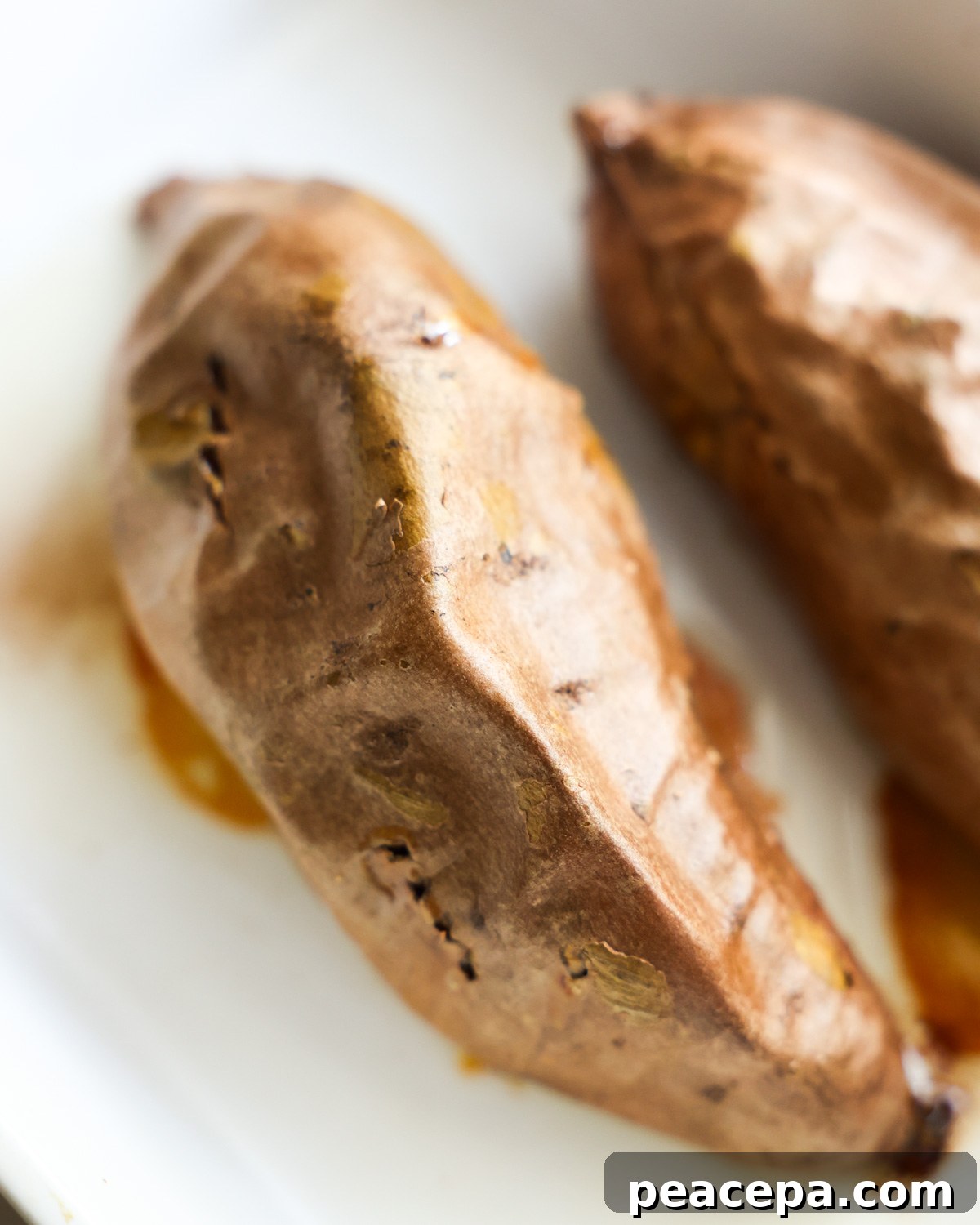 baked sweet potatoes in a white baking sheet