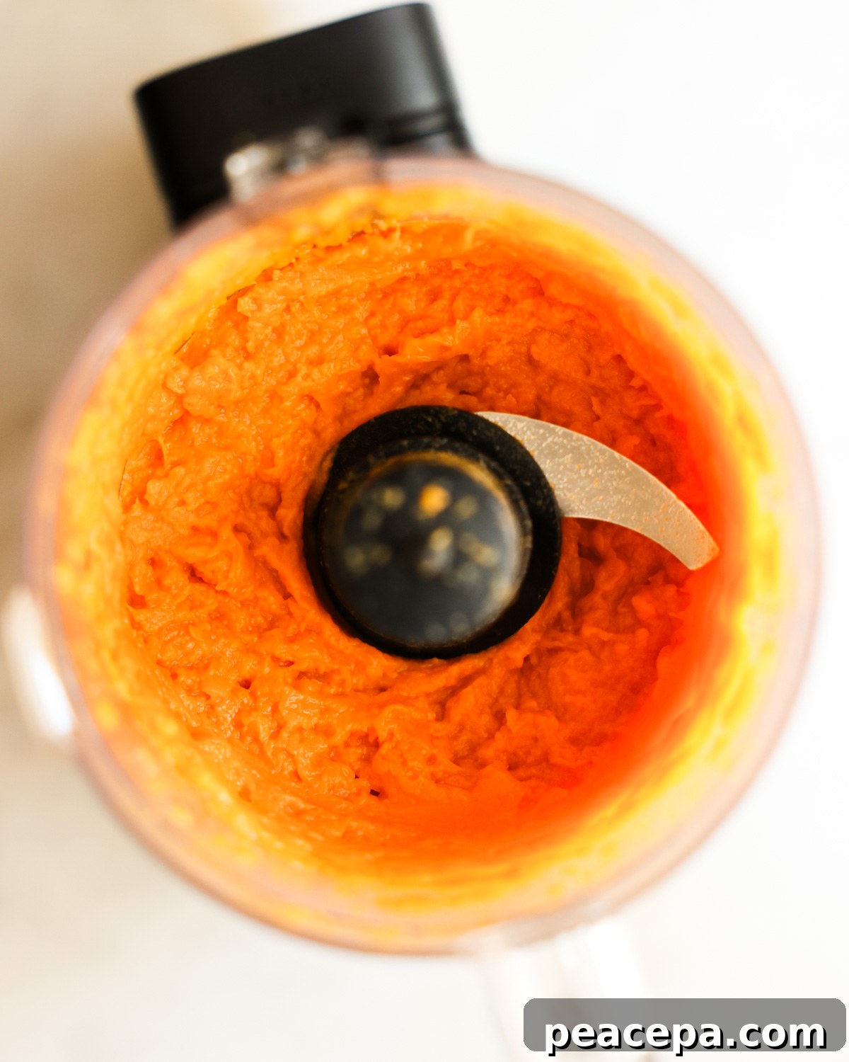 overhead of sweet potato mash in a food processor