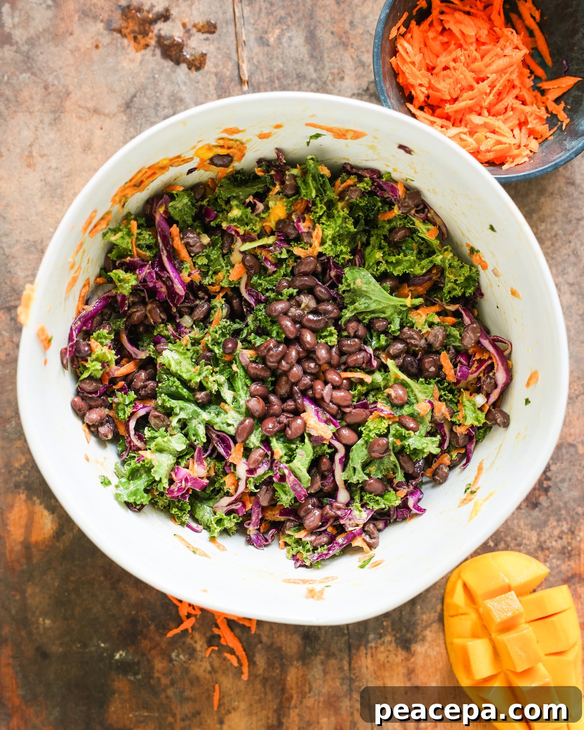 colorful mango avocado in a white mixing bowl
