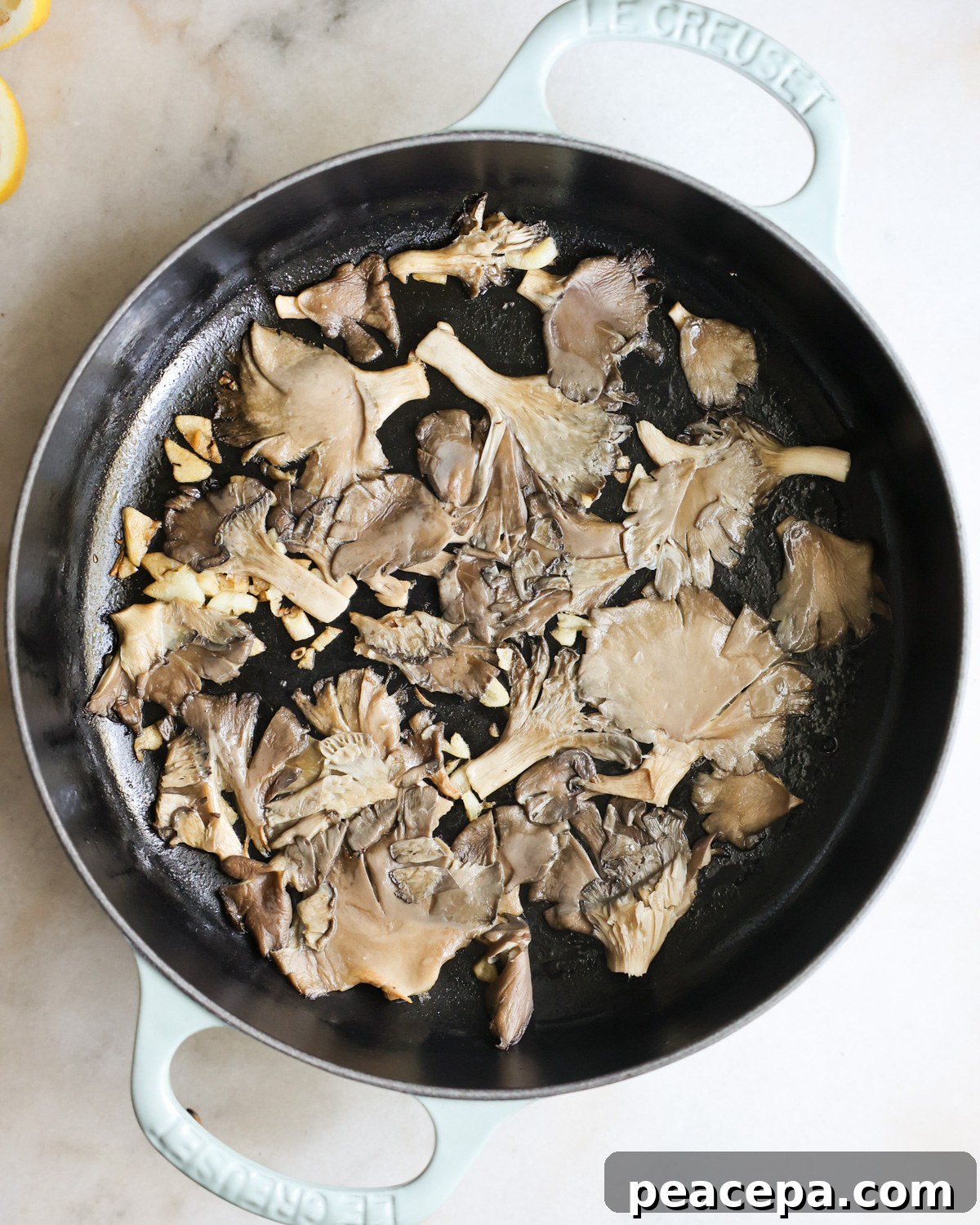 mushrooms cooking in a skillet