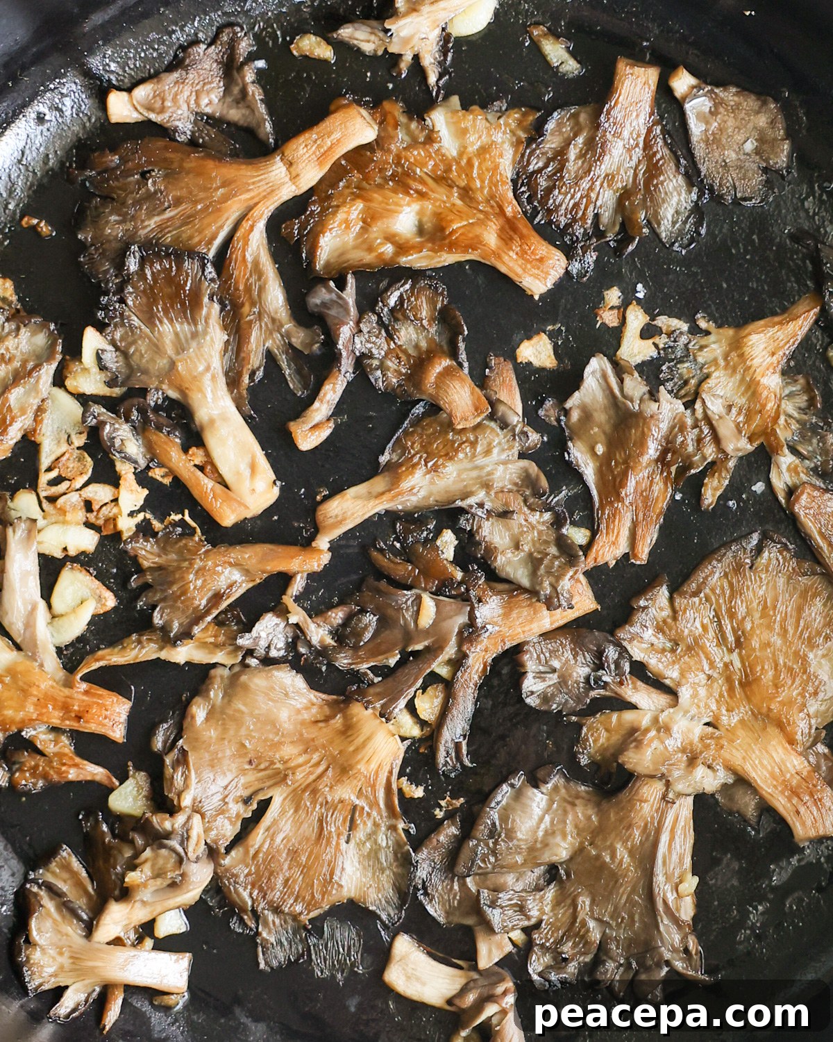 close up of mushrooms cooked in skillet