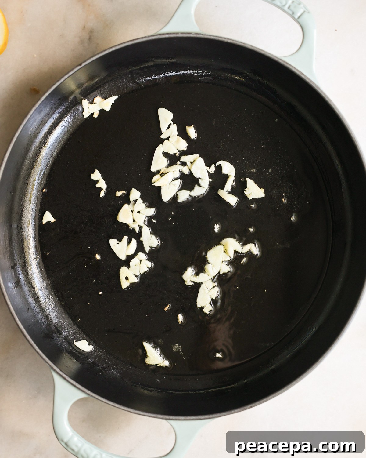 overhead of garlic sautéing 