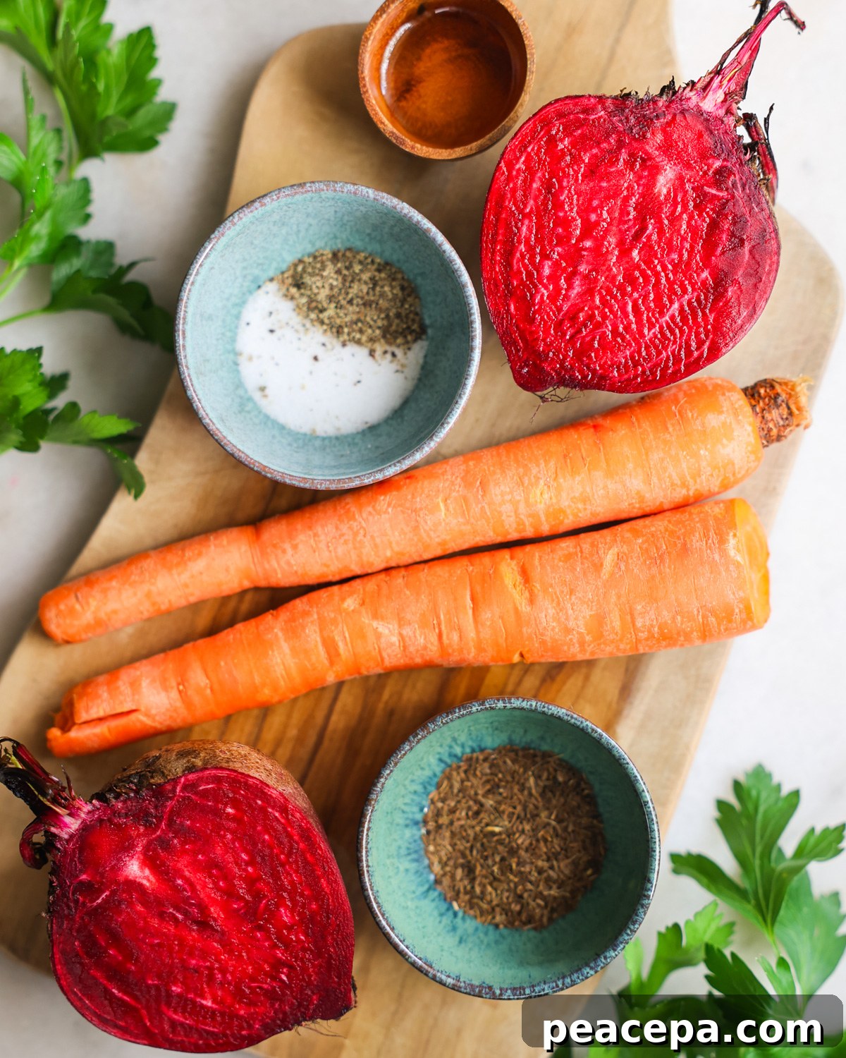 An overhead shot of the ingredients to make roasted beets and carrots.