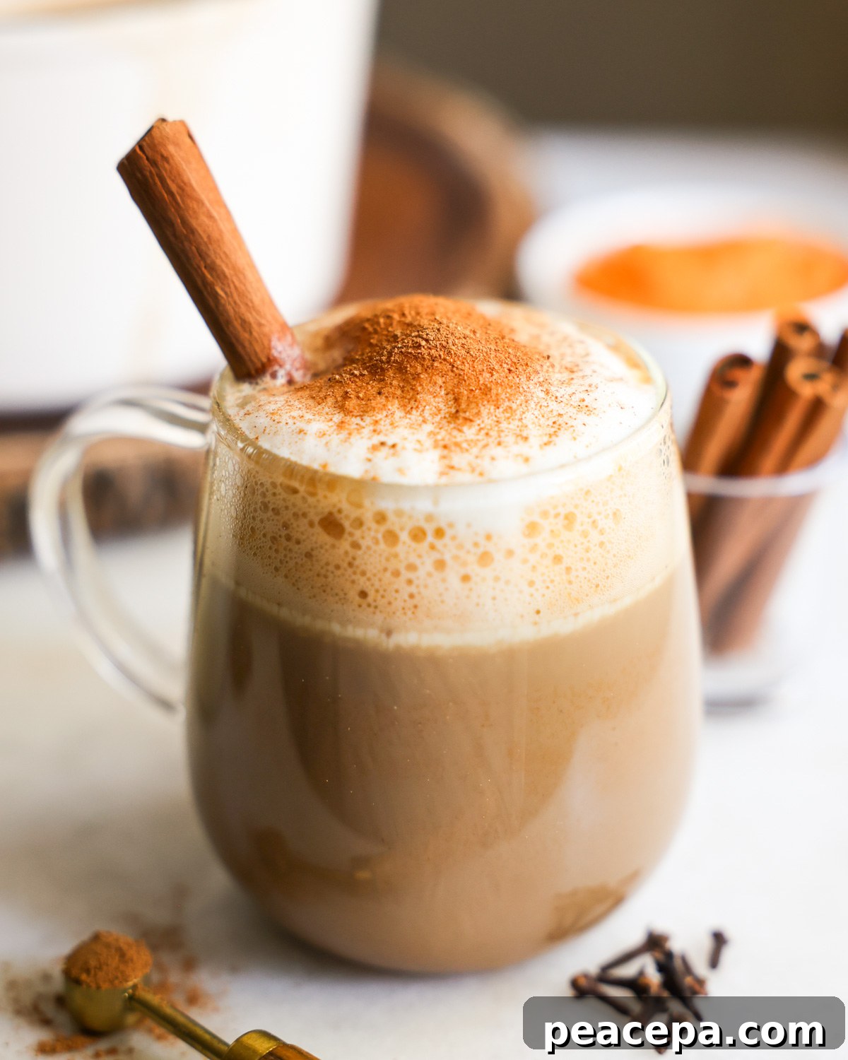 side view of sweet potato latte topped with cinnamon