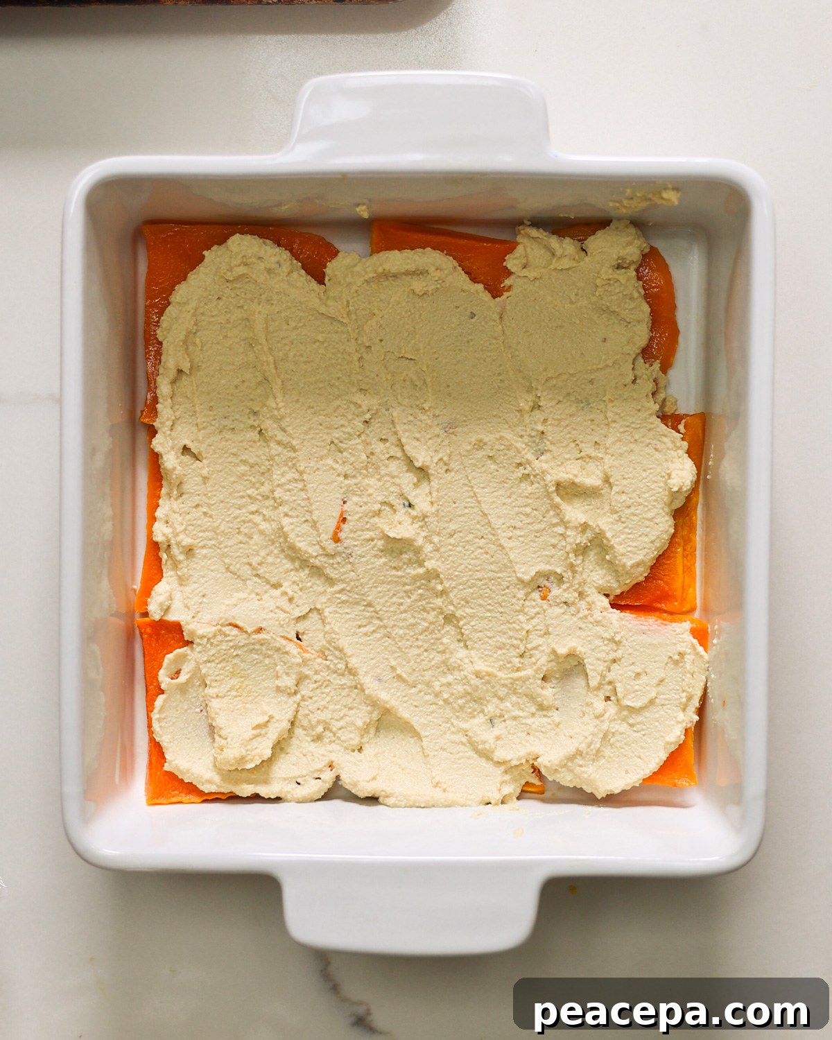 overhead layering butternut squash lasagna 