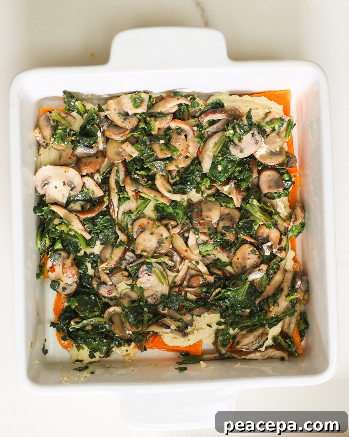 spinach and mushrooms added to lasagna