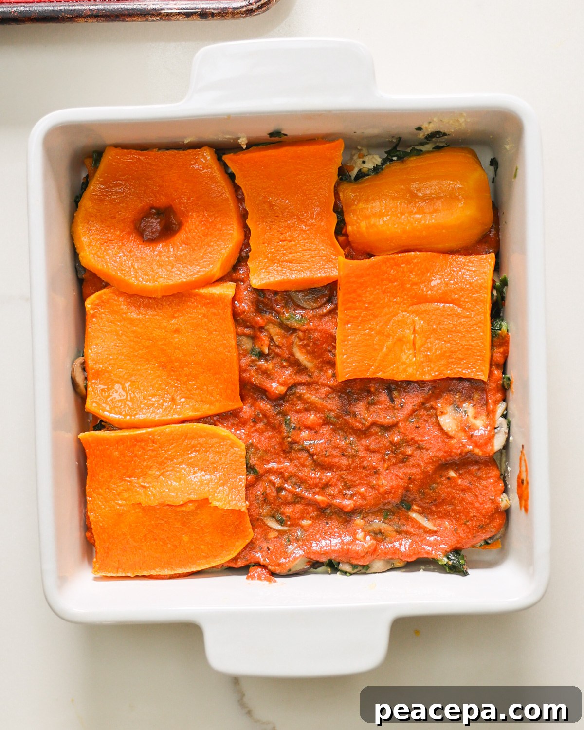 layering butternut squash lasagna 