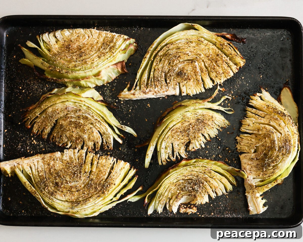 Roasted cabbage on a baking sheet.