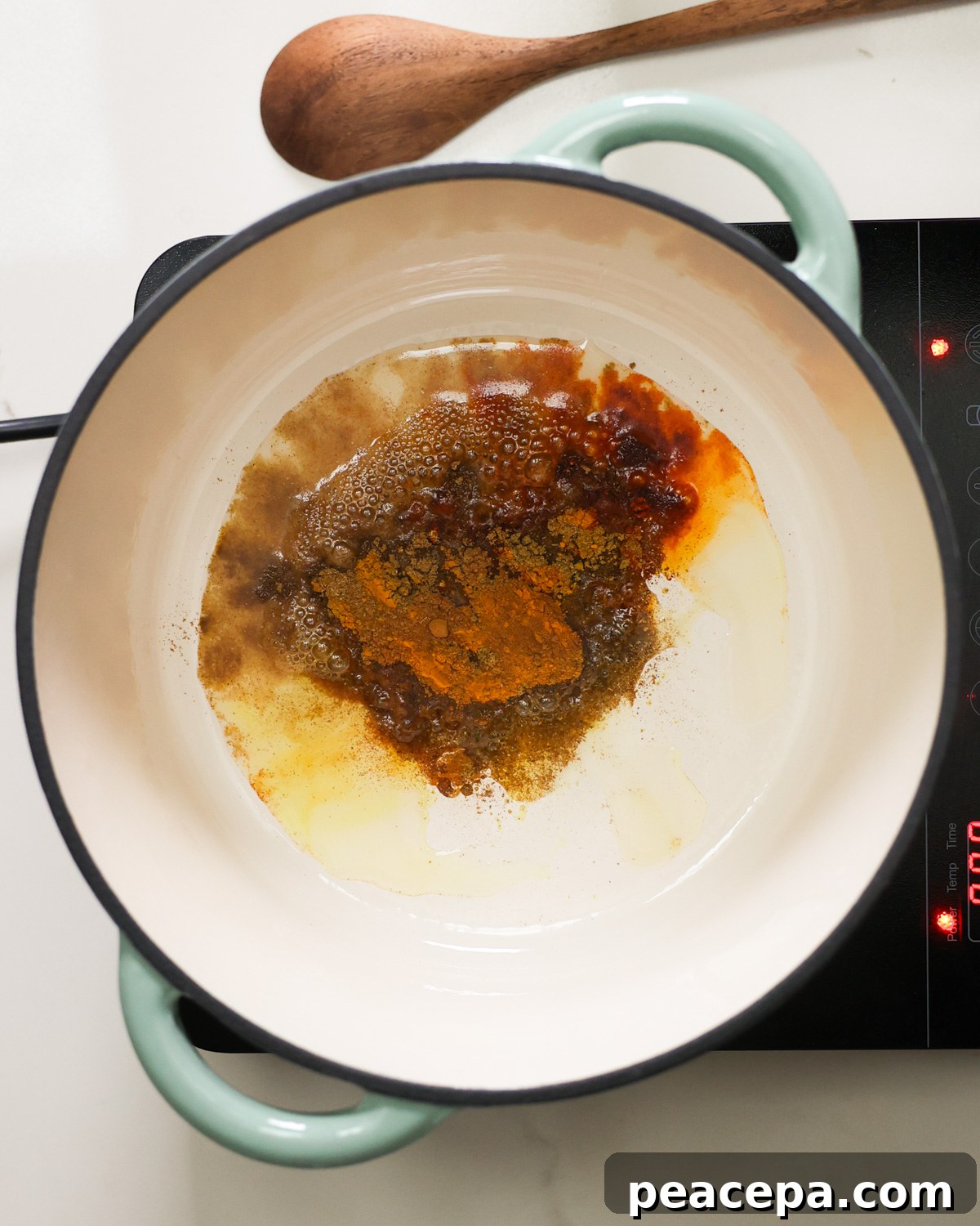 overhead toasting spices in pot
