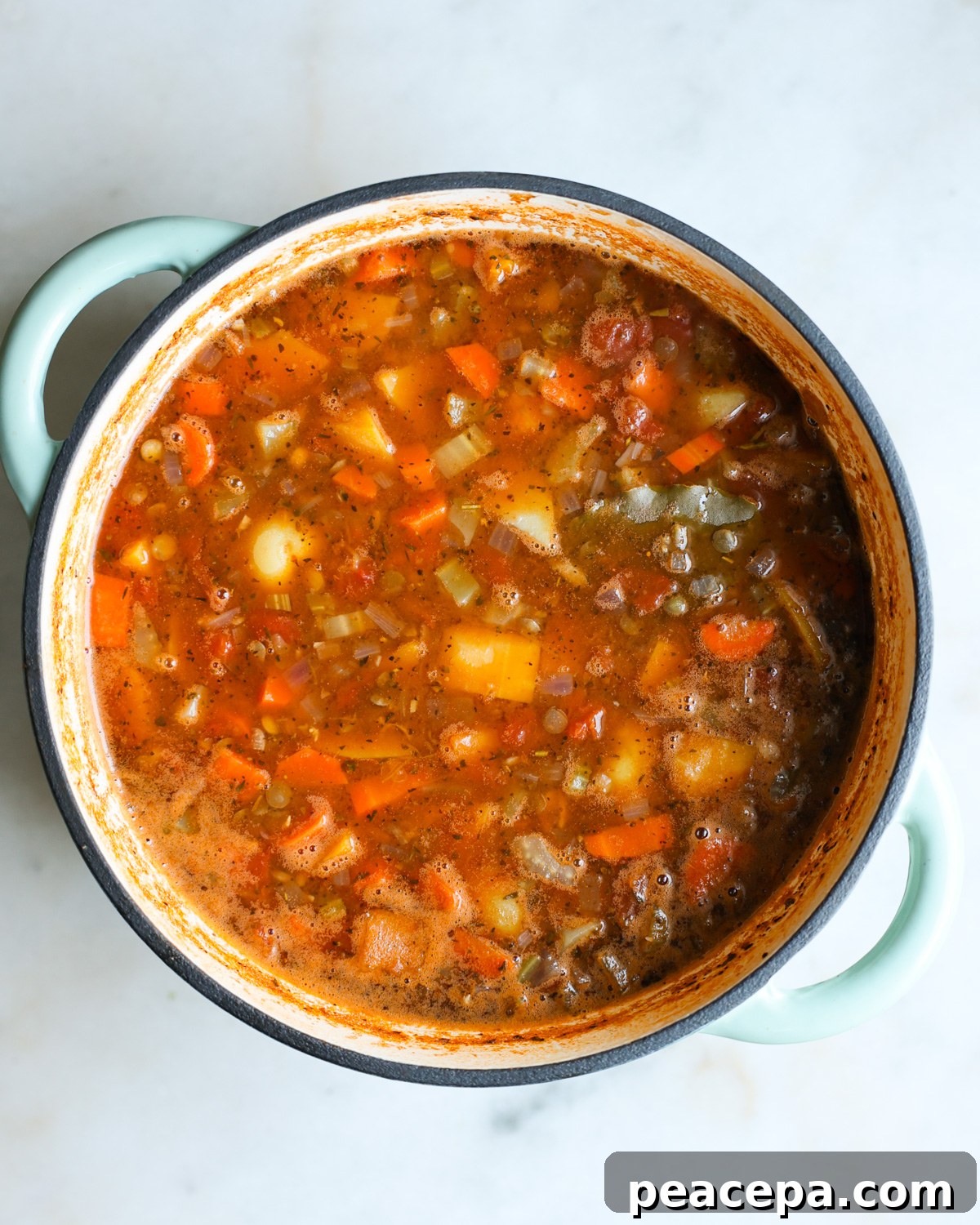An overhead shot of a pot of the butternut squash lentil soup.