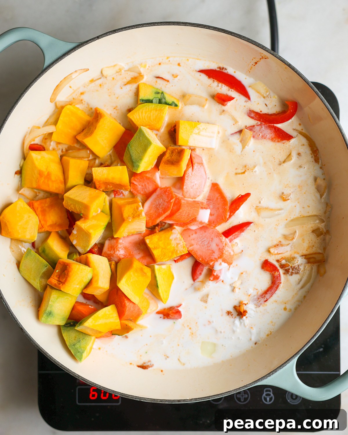 overhead of vegetables added to the pan
