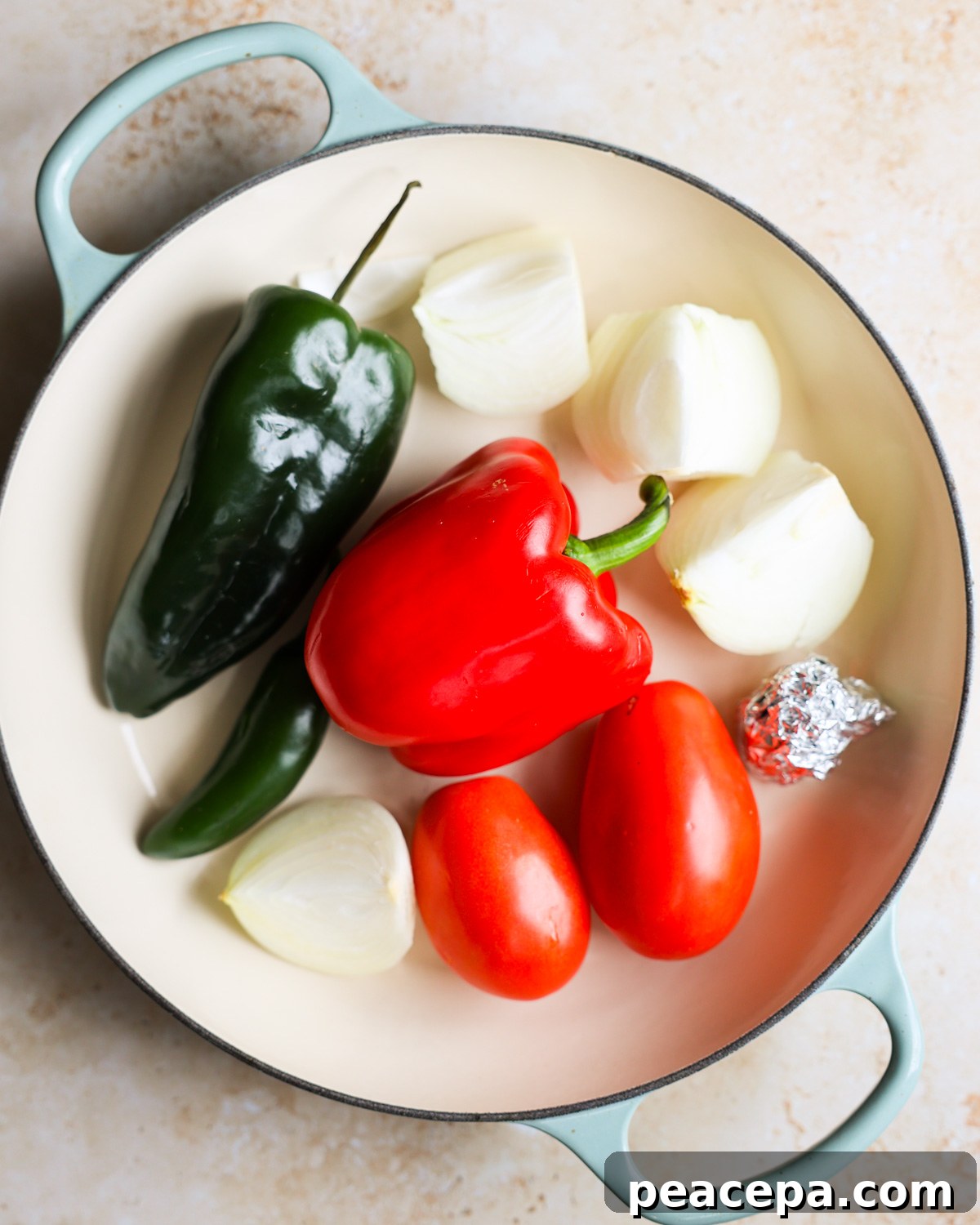 Sofrito ingredients in a skillet.