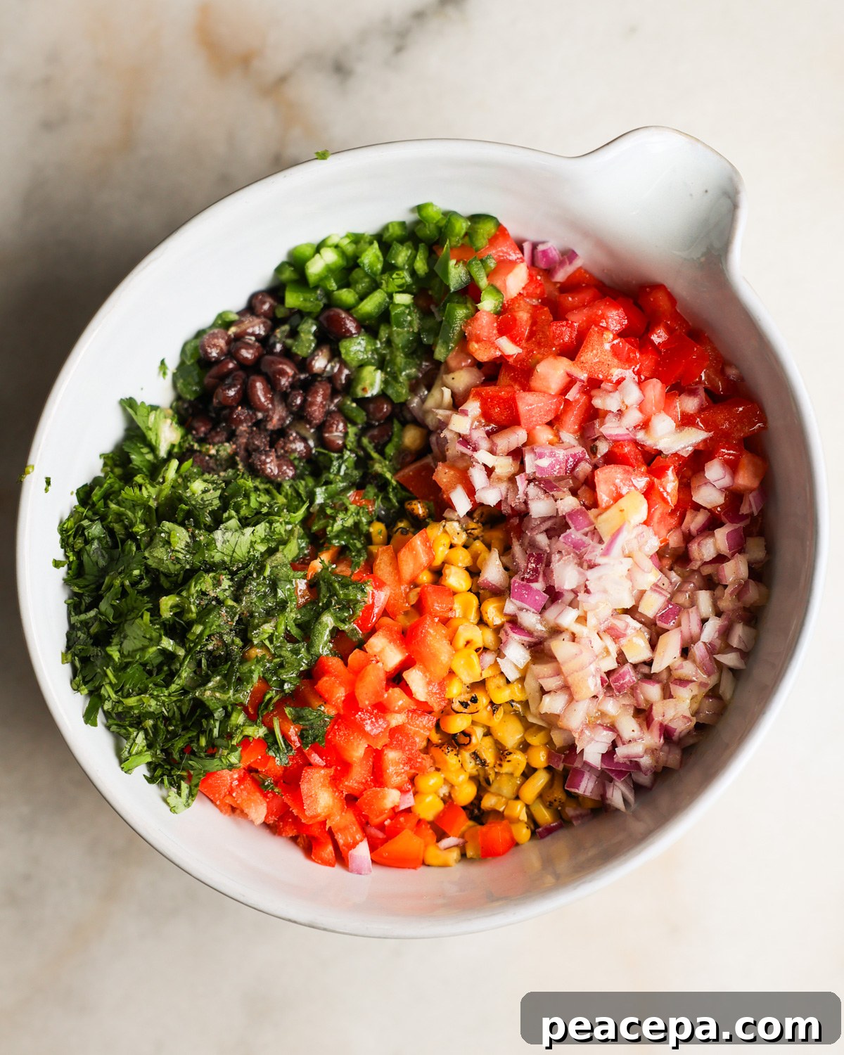 The black bean and corn salad ingredients in a mixing bowl.