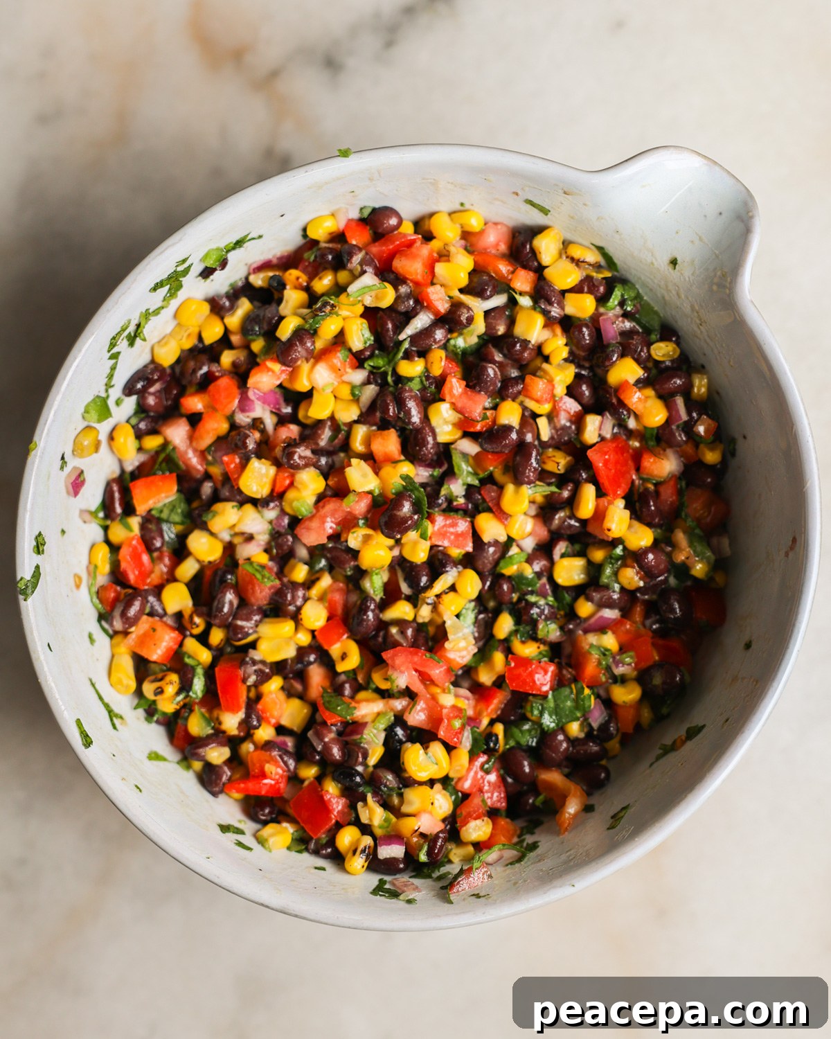 A mixing bowl of the black bean and corn salad.
