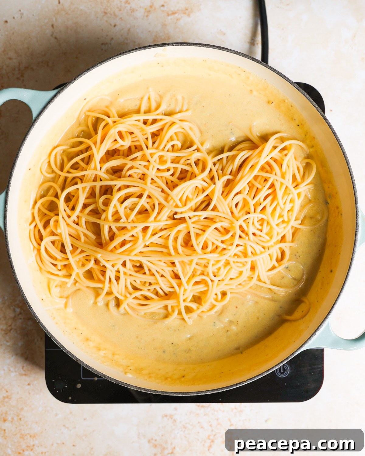 overhead pasta added to sauce