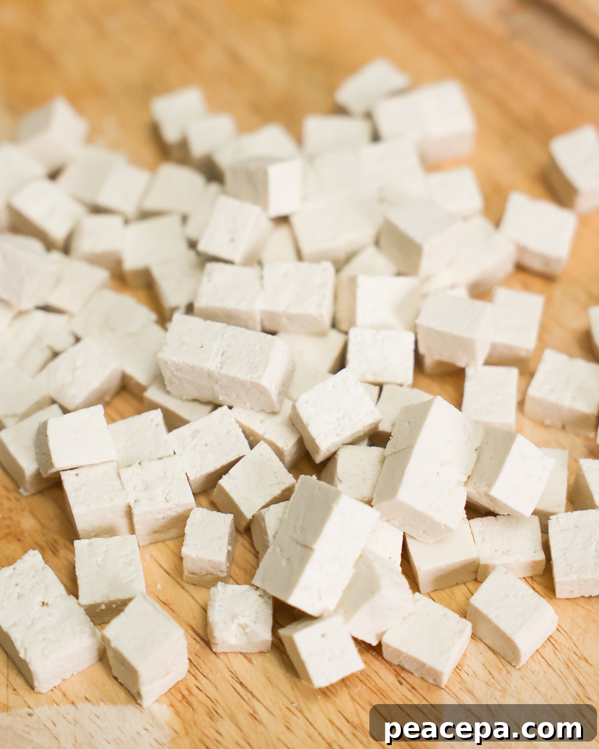 cubed tofu on cutting board