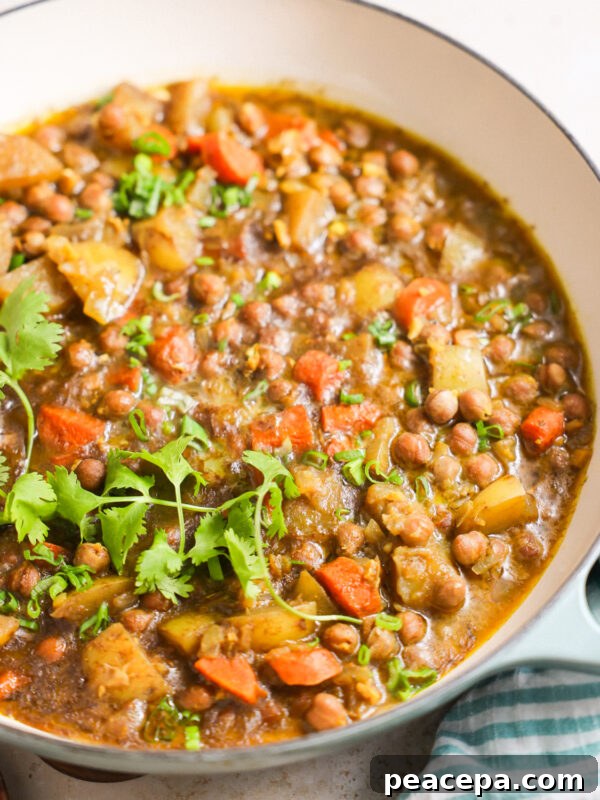 A close-up shot of a large pot of Jamaican chickpea curry.