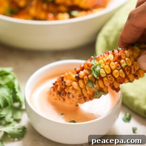 dipping corn ribs in aioli