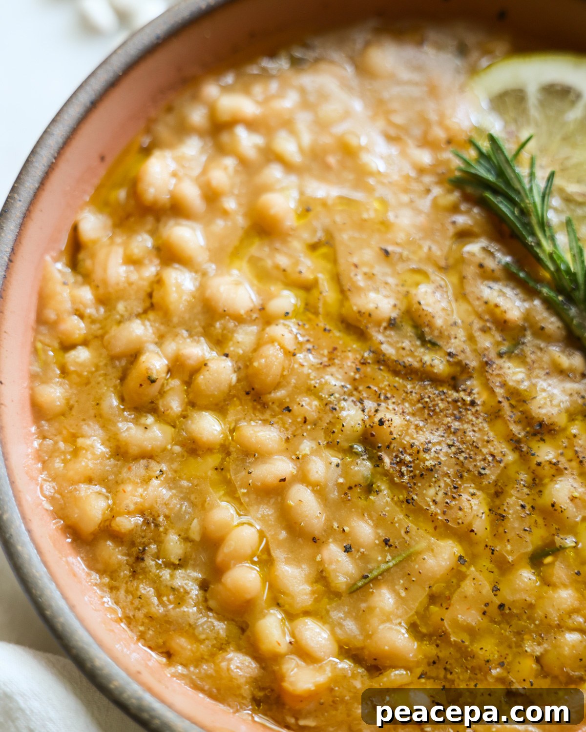 A close-up shot of the instant pot white beans in a bowl.