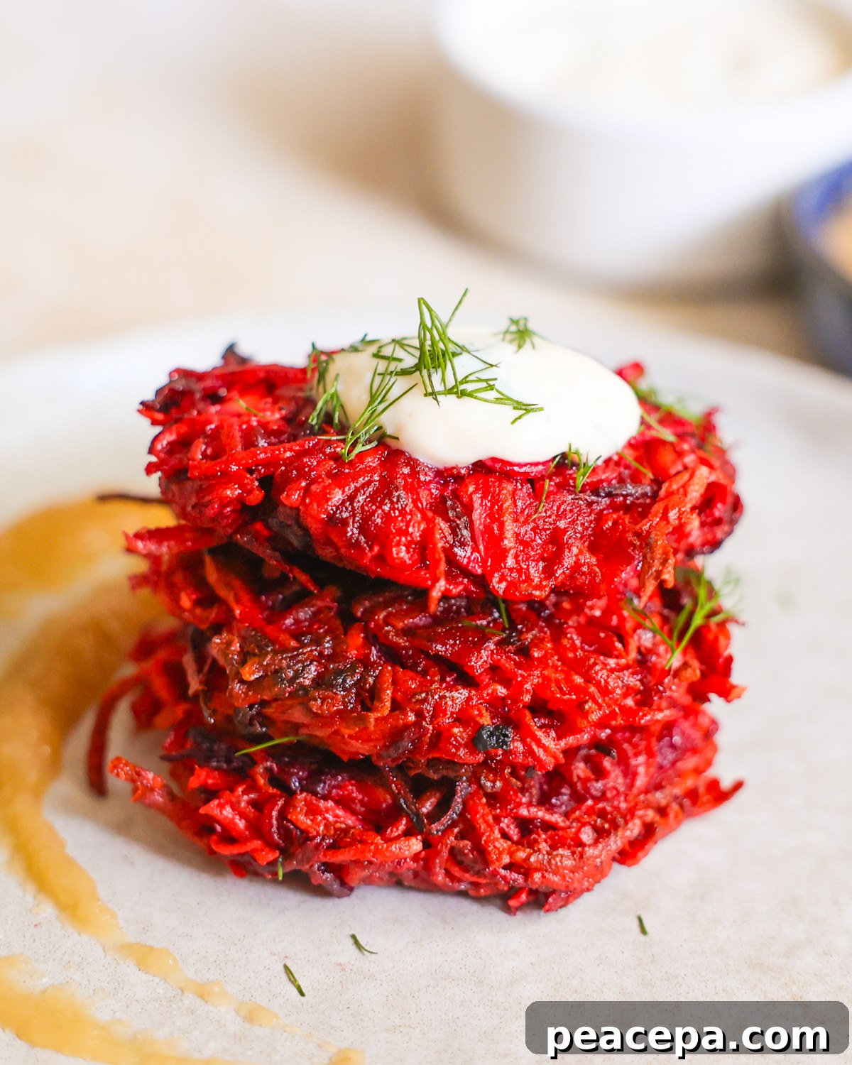 stack of beet and sweet potato fritters