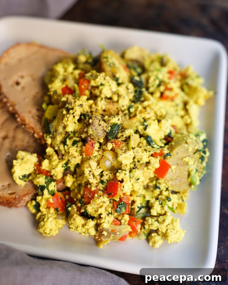 tofu scramble with toast on white plate