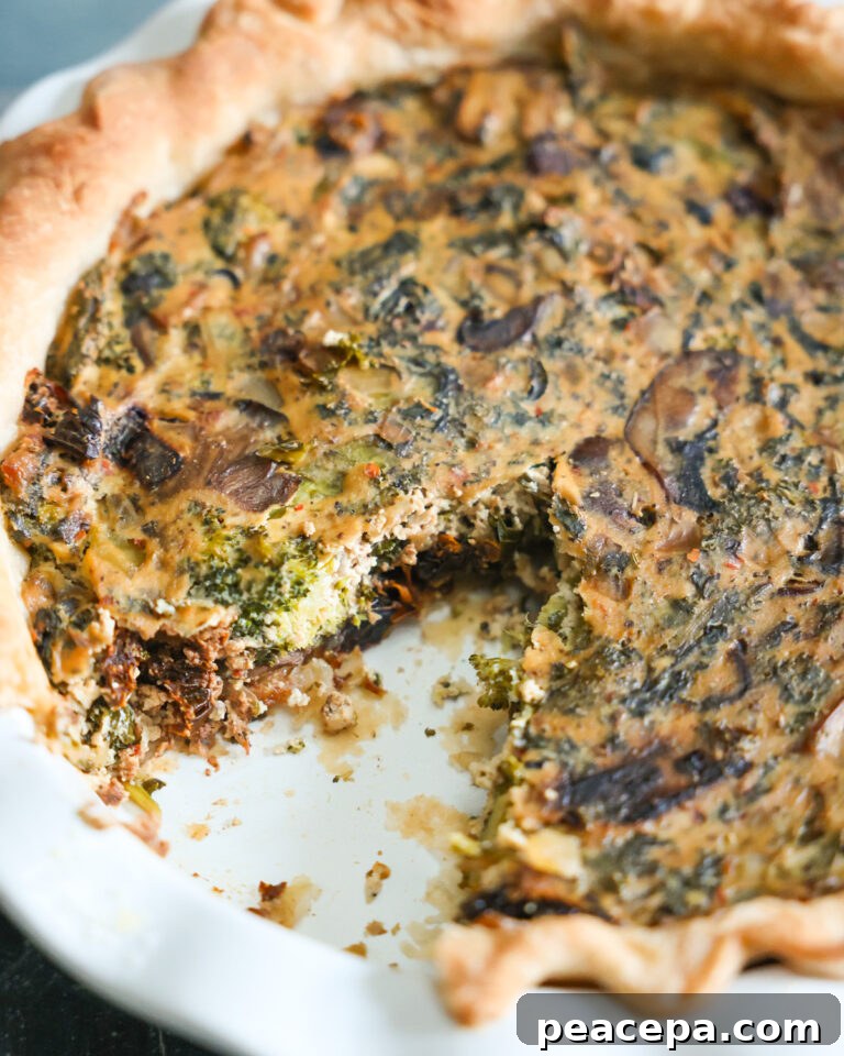 closeup on vegan quiche with missing slice