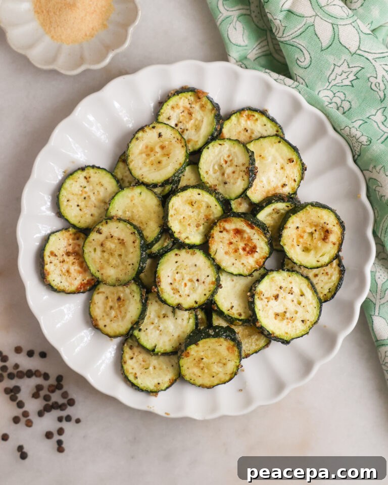 A plate of air fried zucchini on the coutner.
