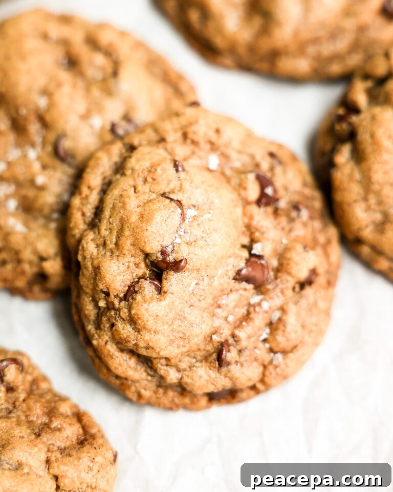 vegan chocolate chip cookie stack on white parchment paper