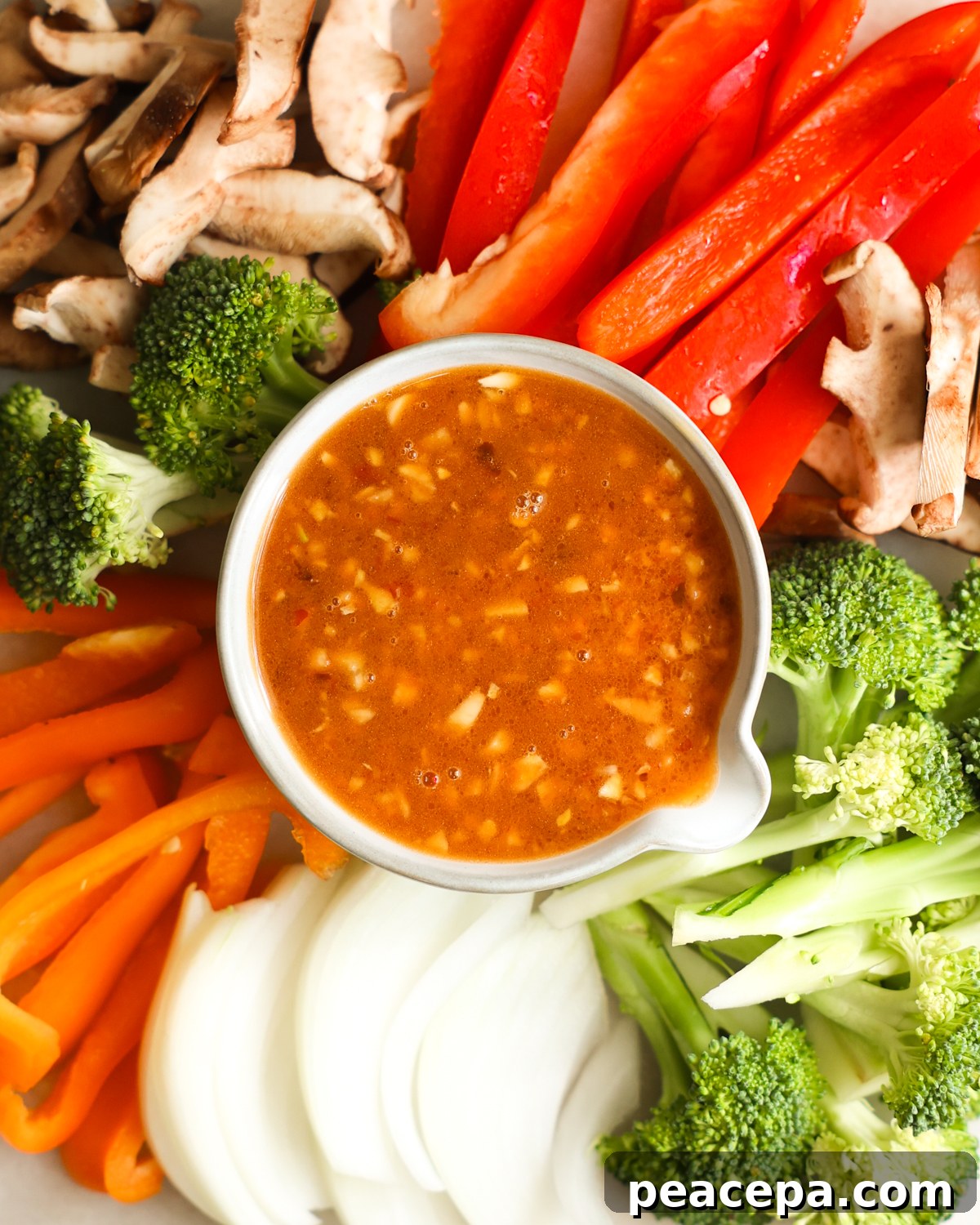 Stir Fry Sauce in bowl surrounded by veggies