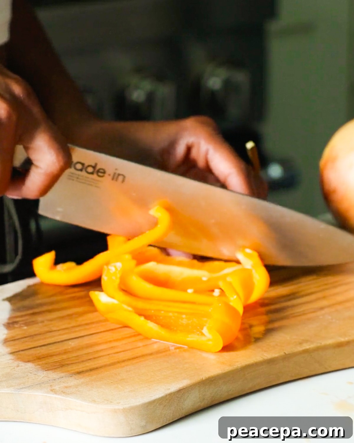 slicing yellow bell pepper