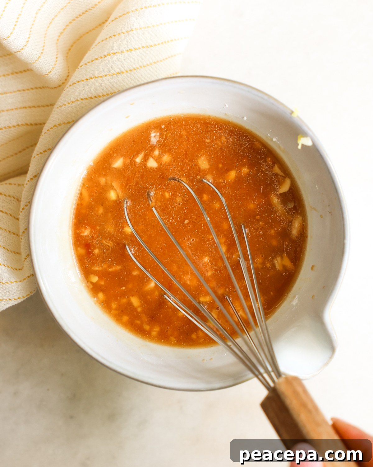 overhead whisking sauce