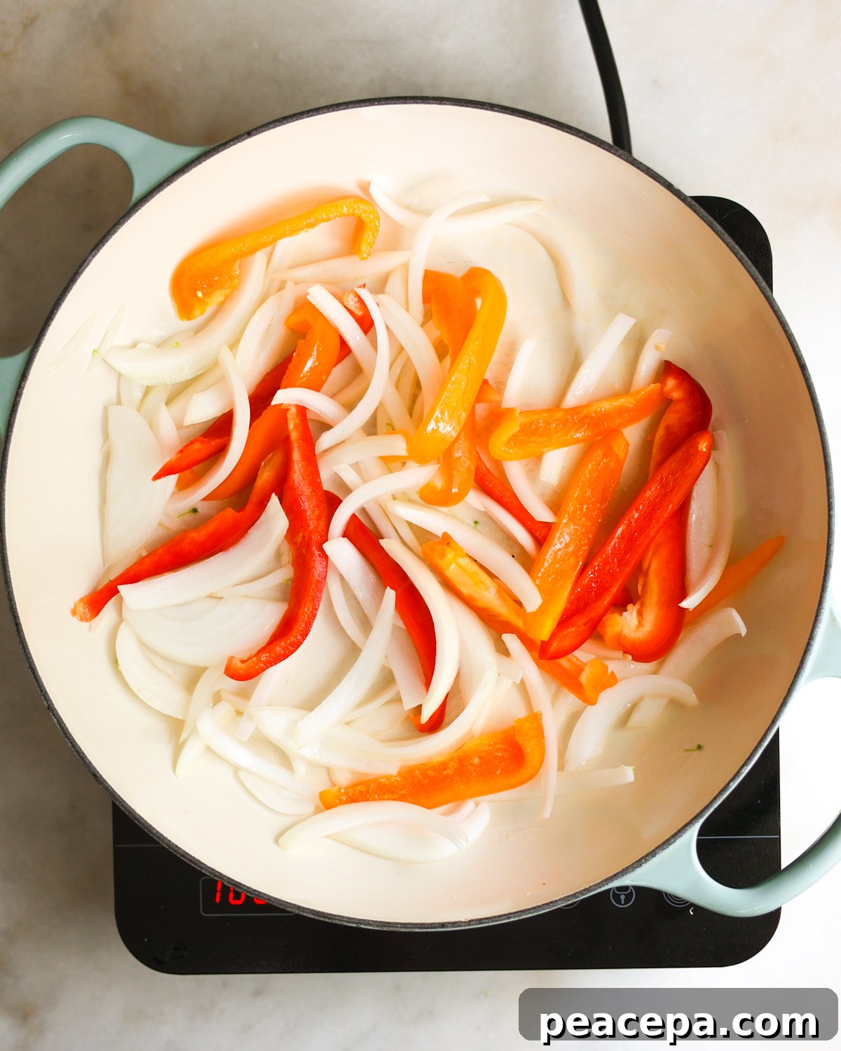 onions and bell pepper sautéing 