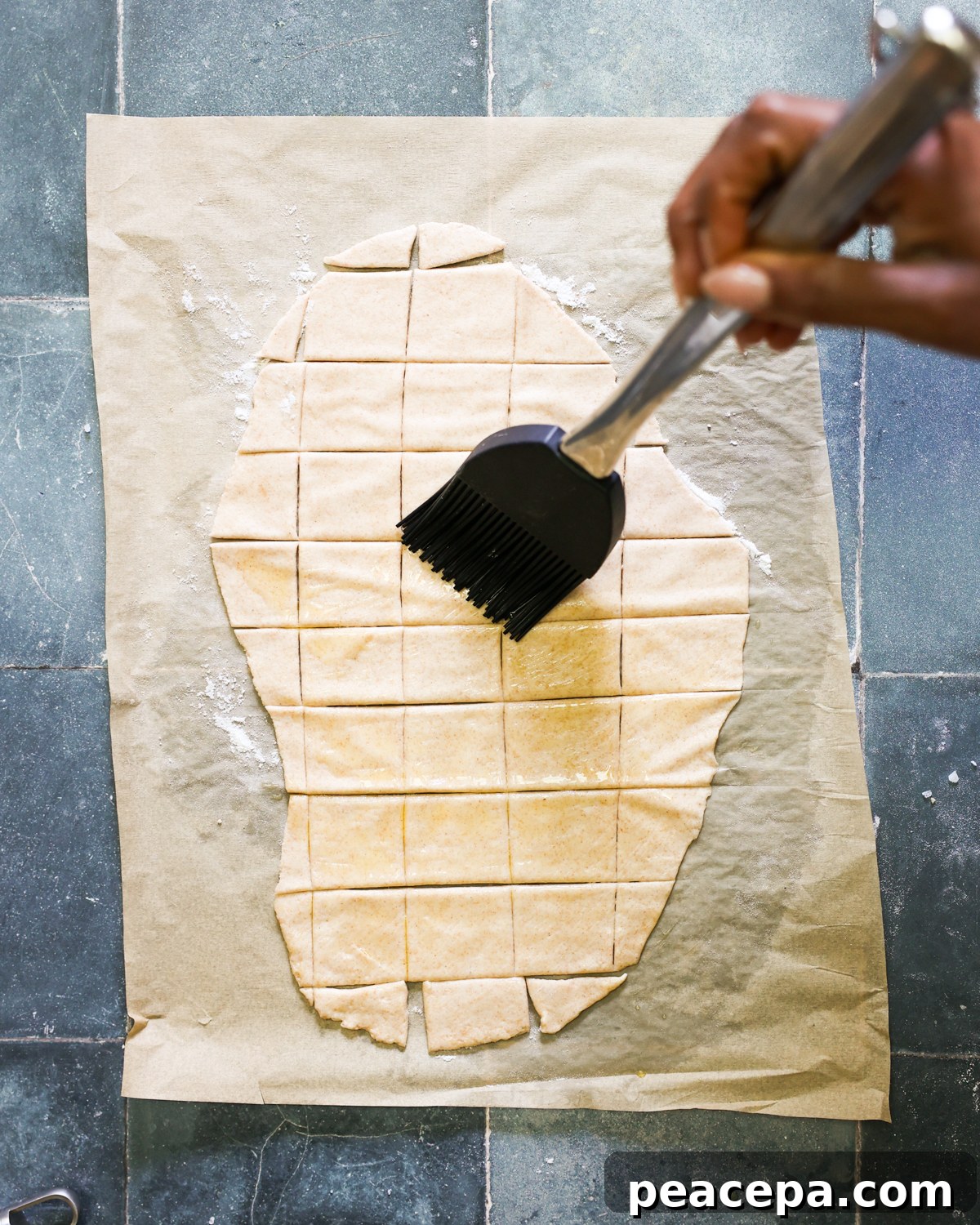 brushing crackers with oil