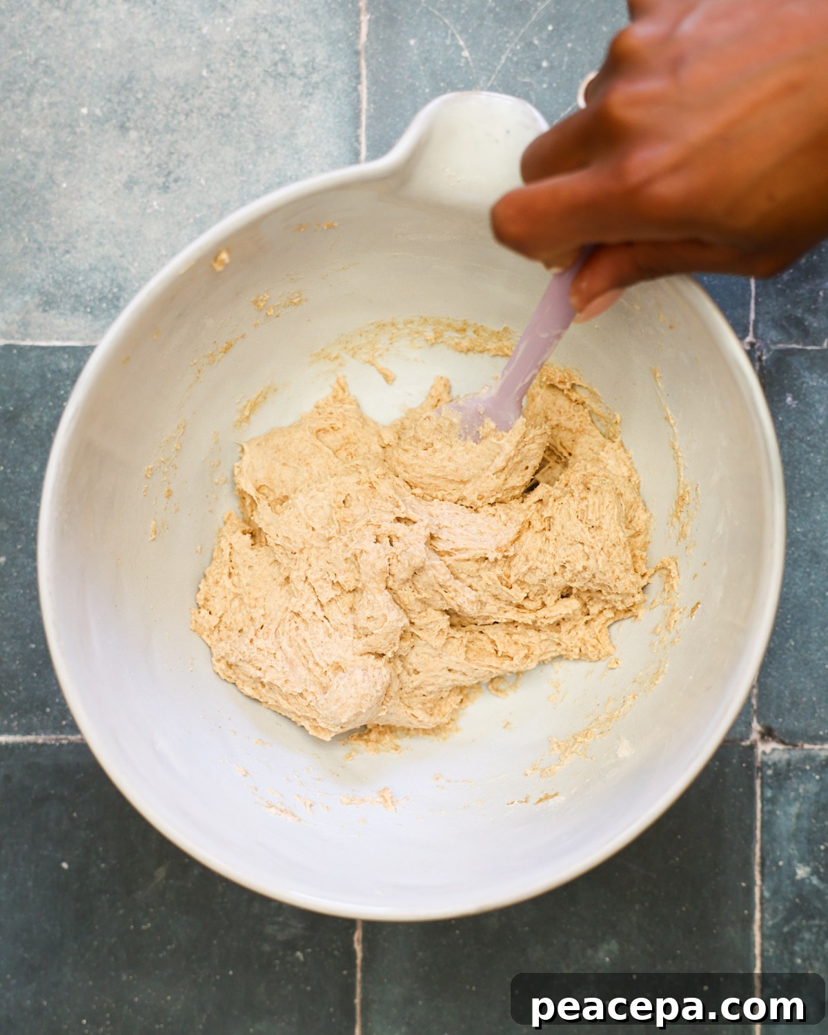 mixing dough in a bowl