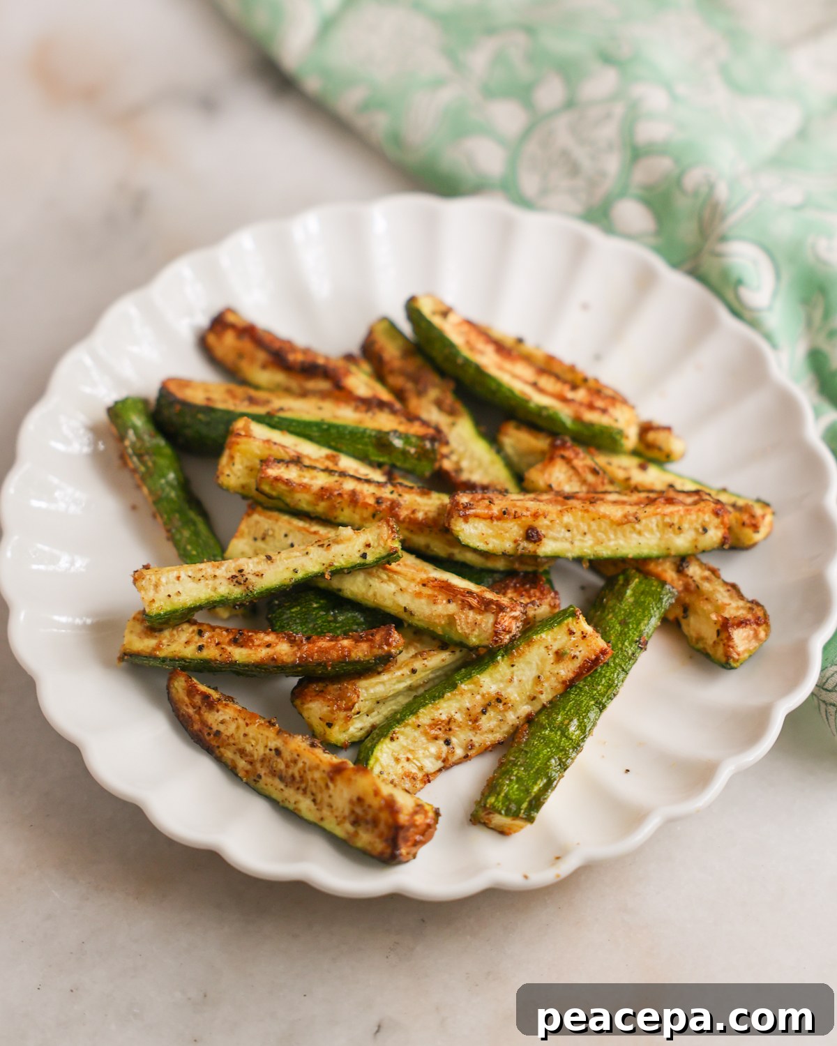 A plate of air fryer zucchini spears.