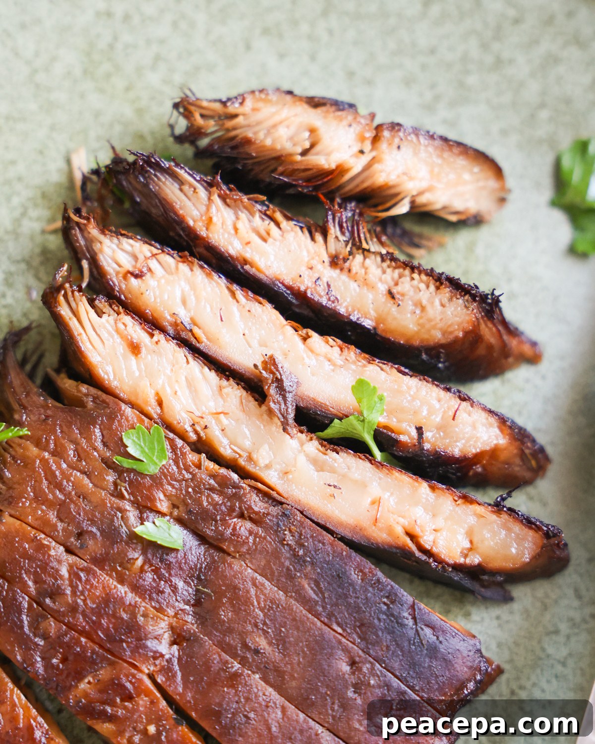 Sliced lions mane mushroom steaks.