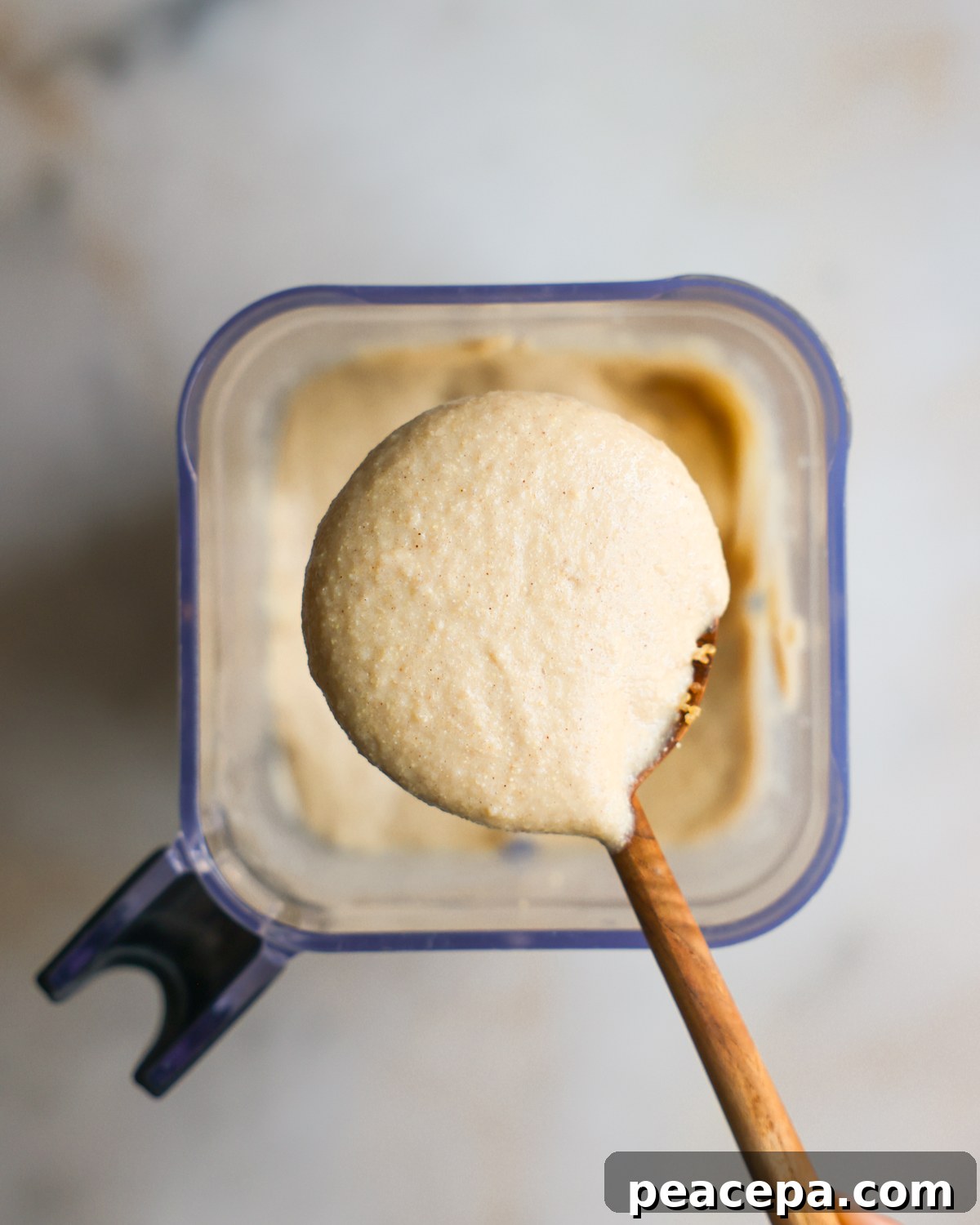 creamy porridge on spoon