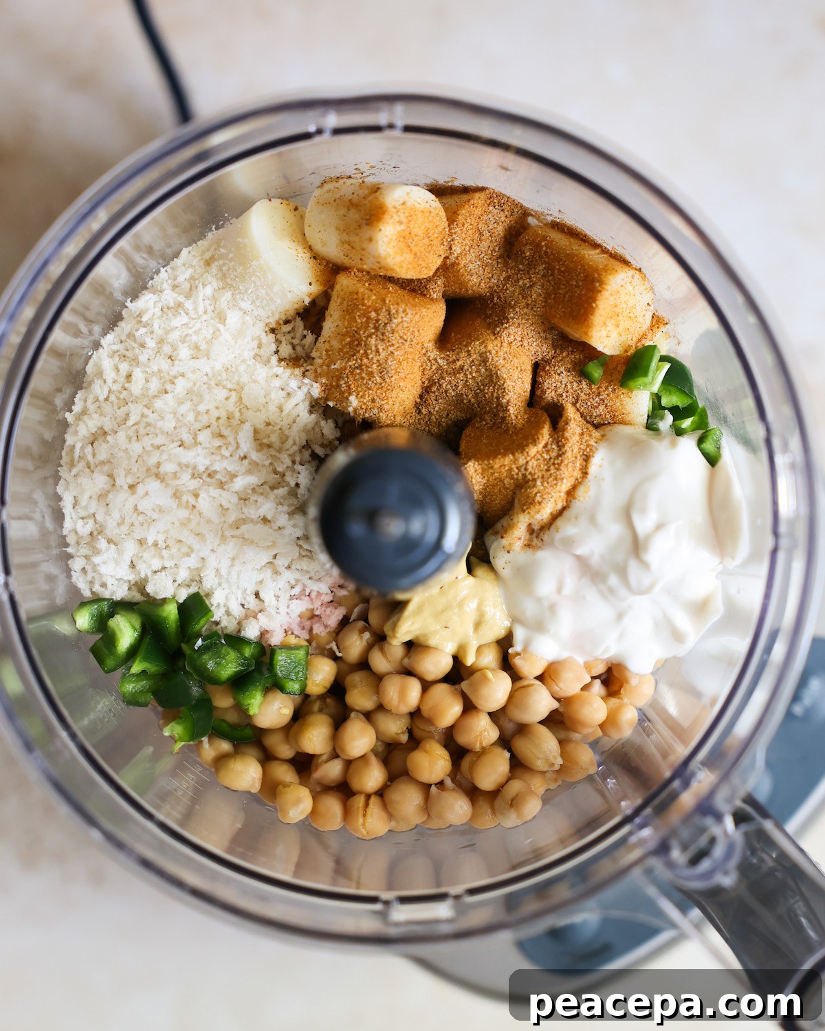overhead of ingredients for vegan crab cakes in a food processor