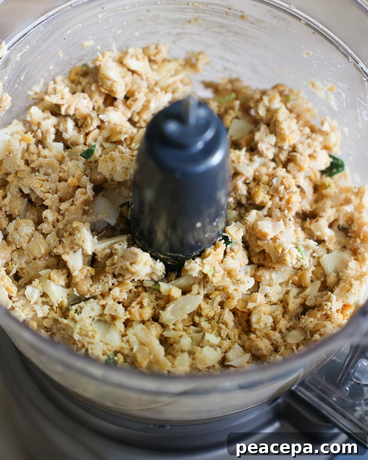overhead of vegan crab cakes batter in a food processor