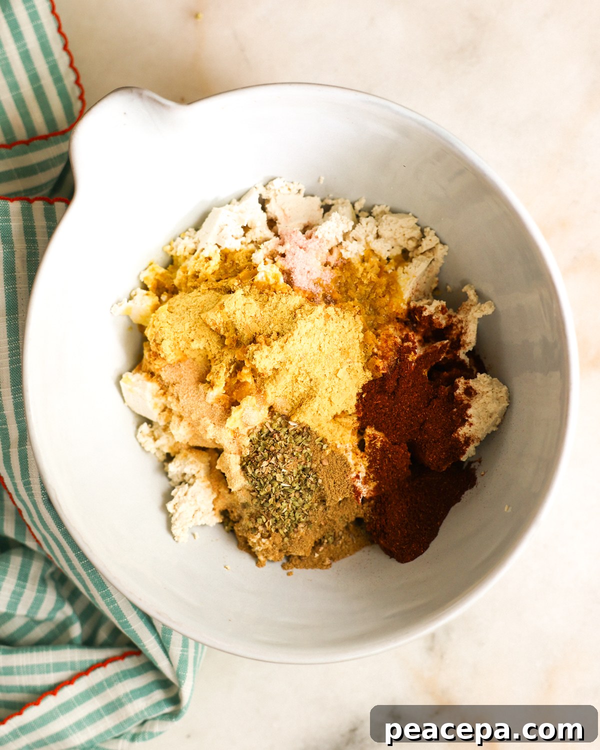 spices added to crumbled tofu