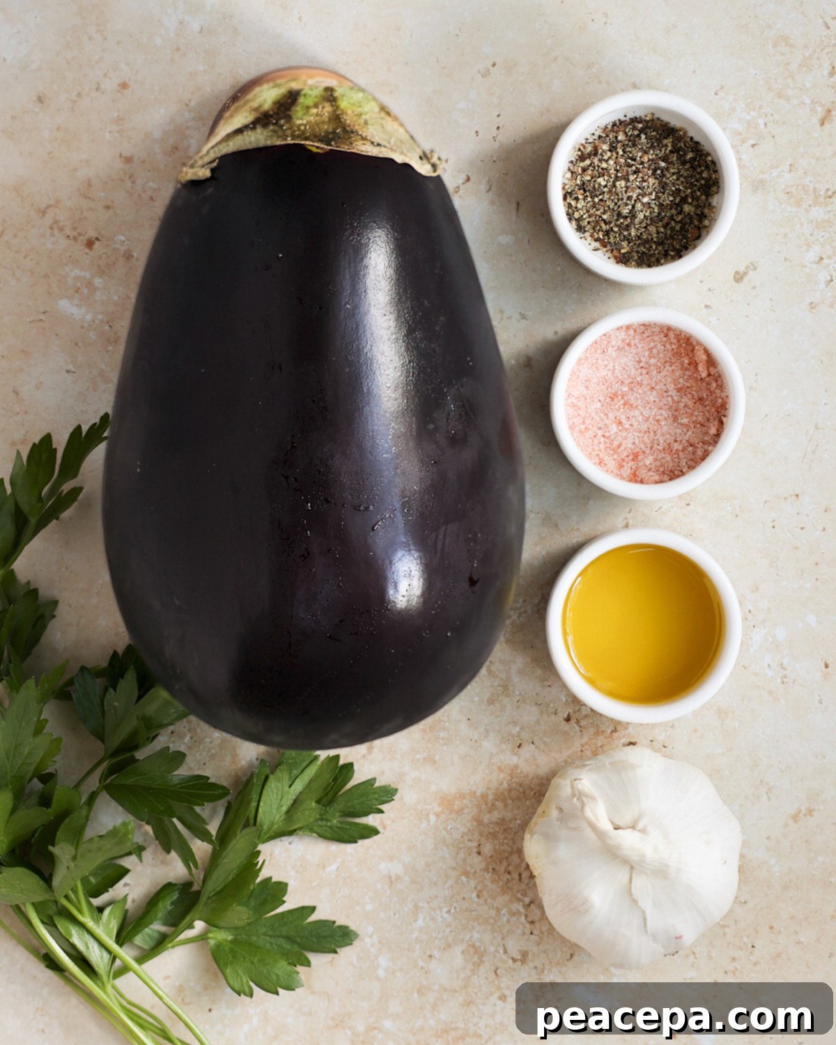All the ingredients needed to make air fryer eggplant on the counter.