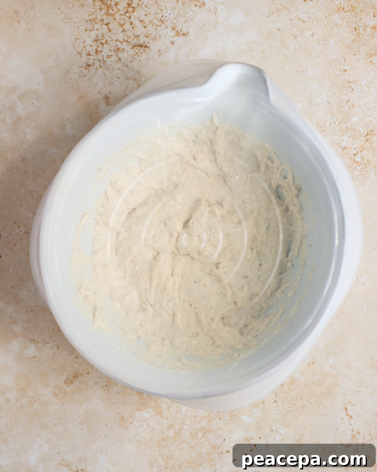 A covered mixing bowl of the sourdough discard pancake batter.