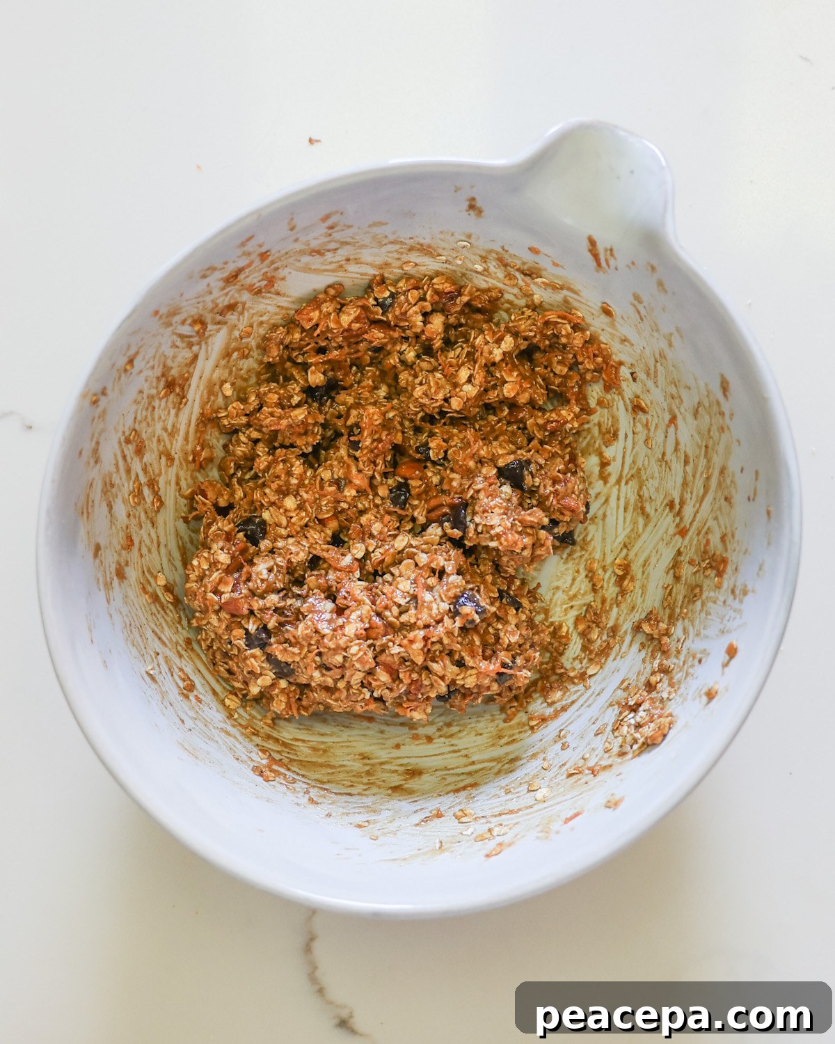 An overhead shot of a mixing bowl of the tahini cookie batter.