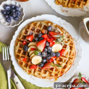 plated vegan waffles topped with fresh fruit