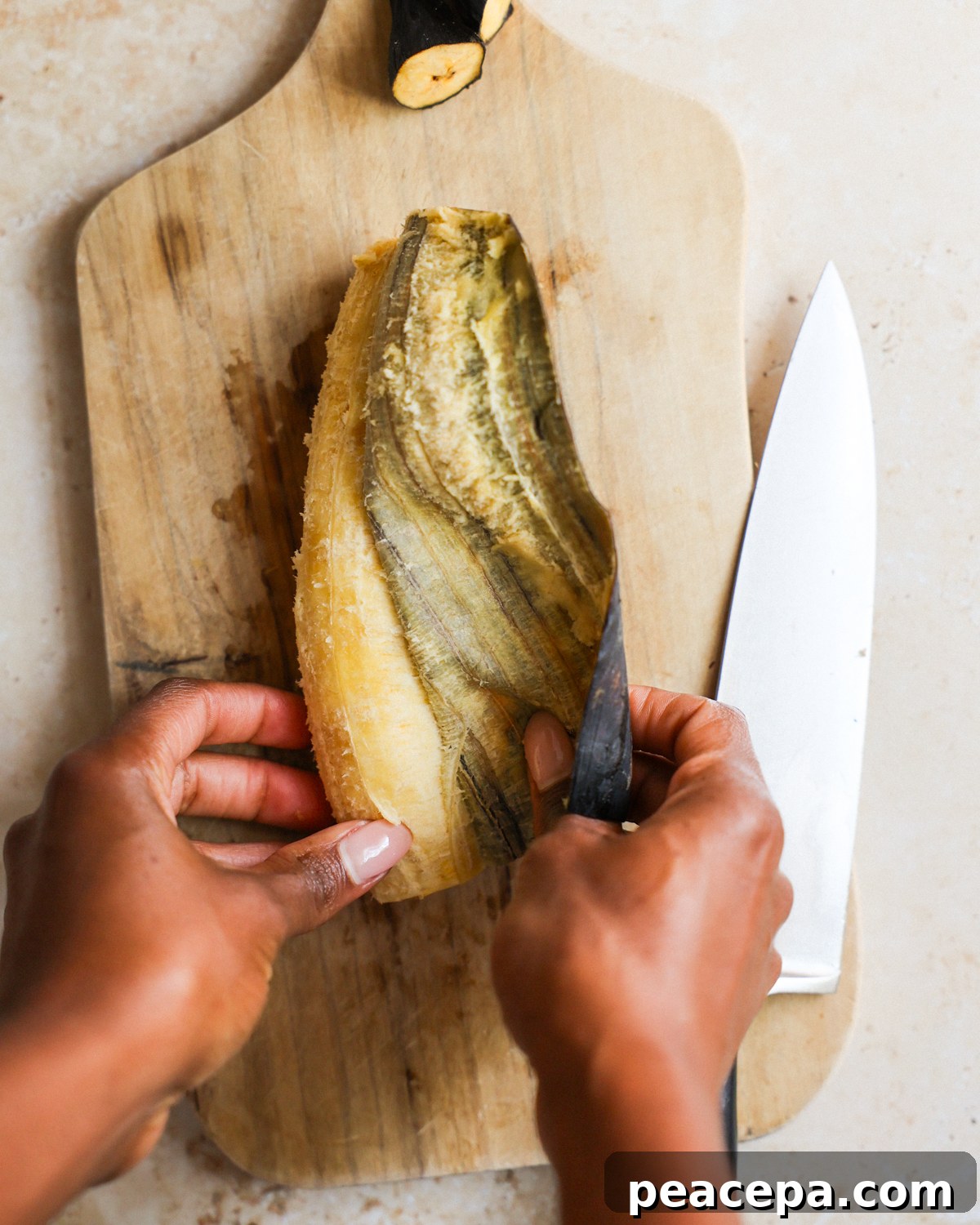overhead removing peel from the plantain