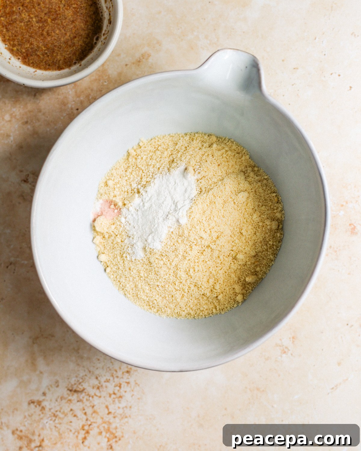 Almond cookie dry ingredients in bowl. 