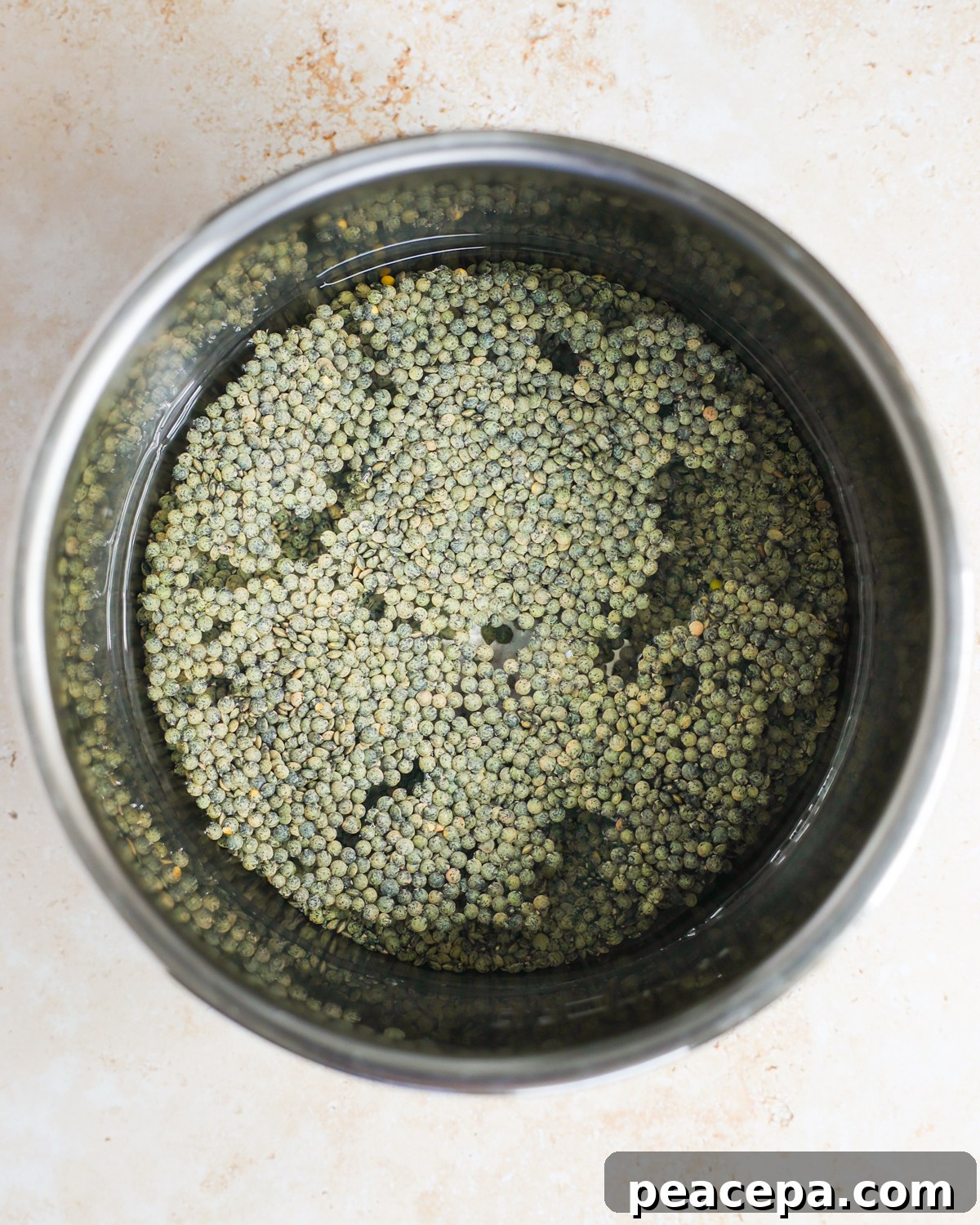 Lentils and water in a pot.