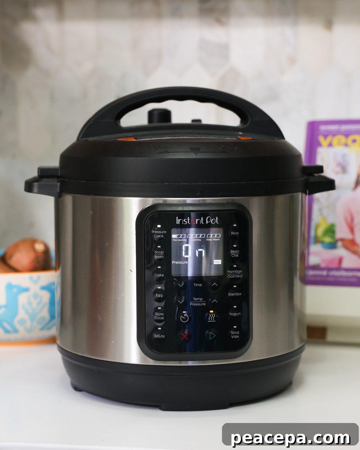 Instant pot electric pressure cooker on counter.