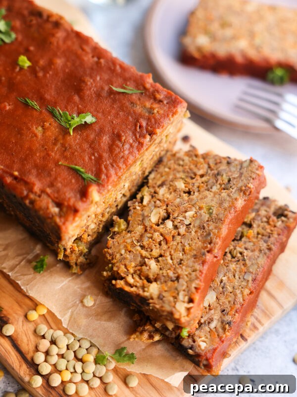 vegan meatloaf sliced on wooden tray