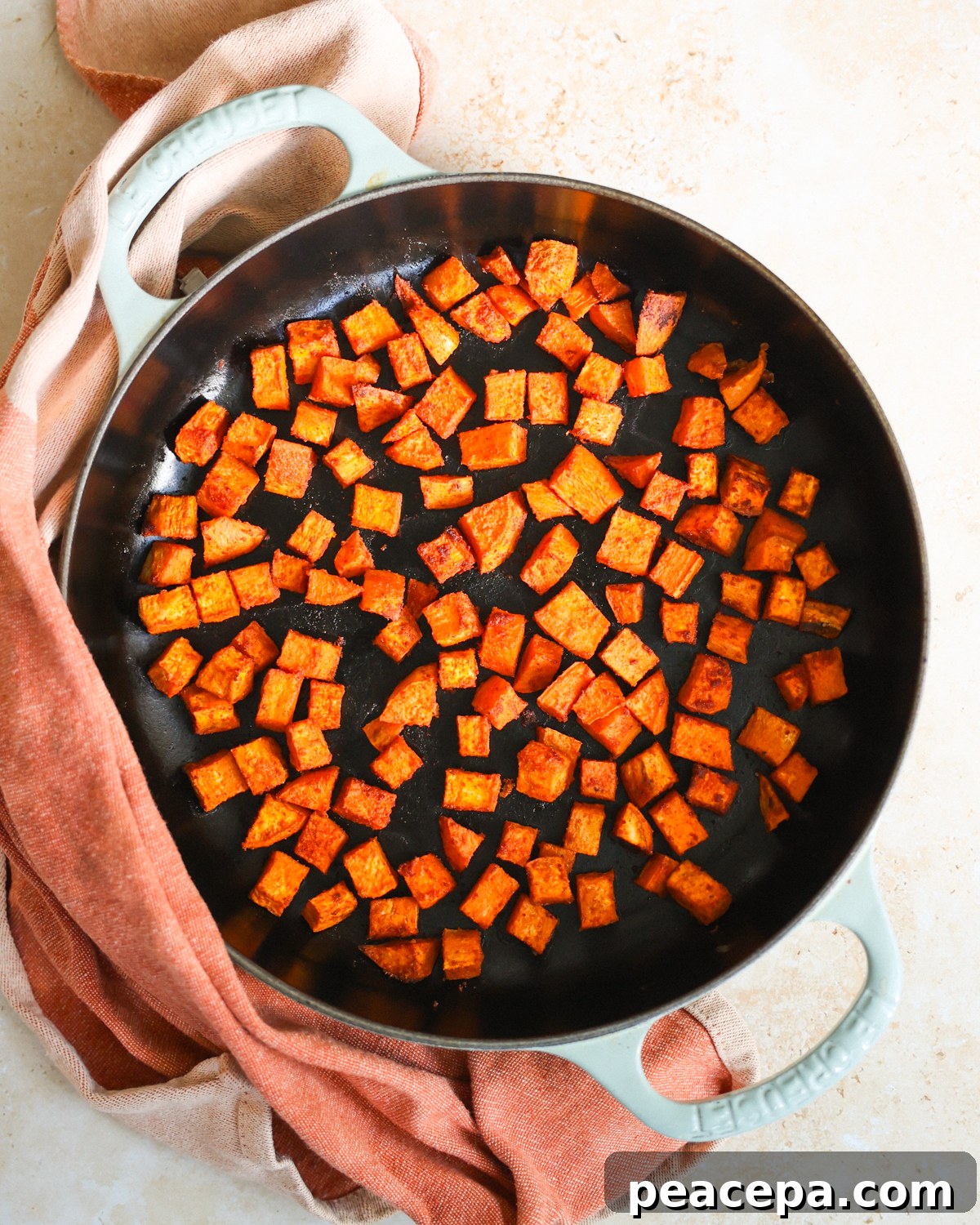 Roasted sweet potatoes in a skillet.